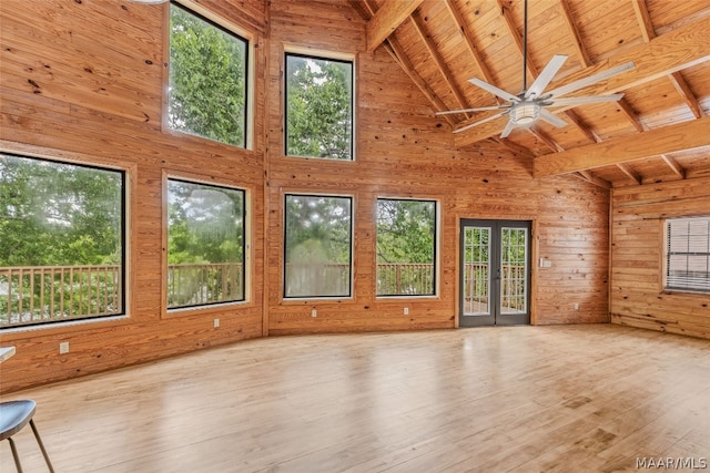 interior space featuring beamed ceiling, high vaulted ceiling, light hardwood / wood-style flooring, ceiling fan, and wood ceiling