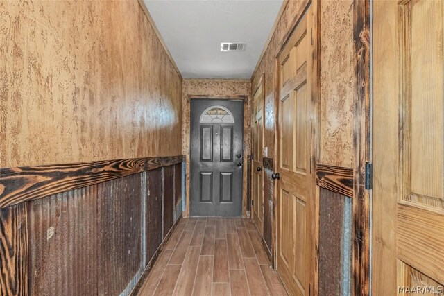 entryway with hardwood / wood-style flooring