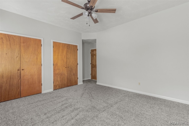 unfurnished bedroom with ceiling fan and carpet floors