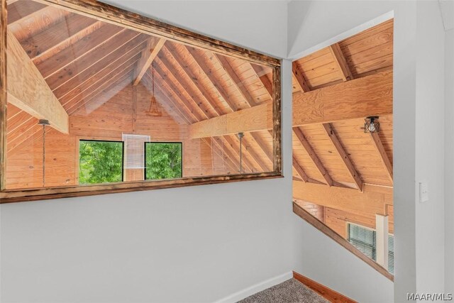 interior space featuring wooden ceiling and beamed ceiling