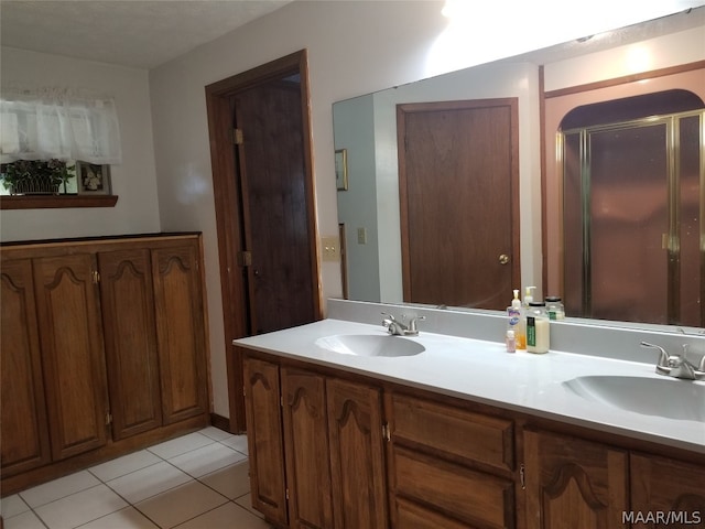 bathroom with tile patterned flooring and vanity