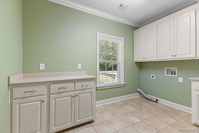 laundry area featuring hookup for an electric dryer, hookup for a washing machine, cabinets, ornamental molding, and light tile patterned floors