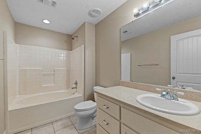 full bathroom featuring tile patterned flooring, vanity, toilet, and shower / washtub combination