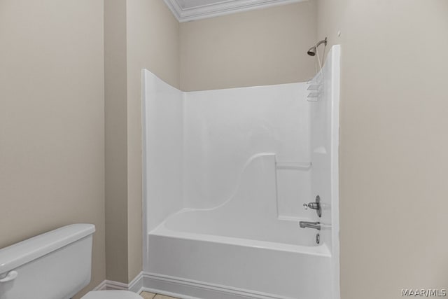 bathroom with crown molding,  shower combination, and toilet