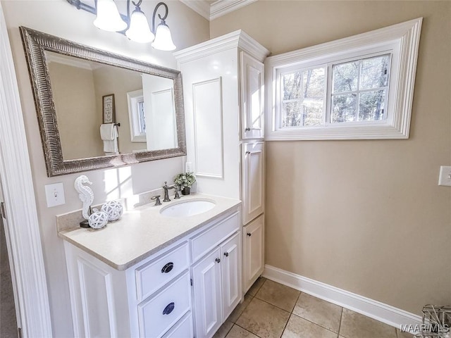 bathroom with tile patterned floors, crown molding, and vanity