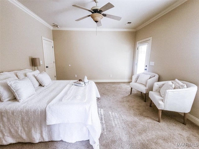 carpeted bedroom with ceiling fan and ornamental molding