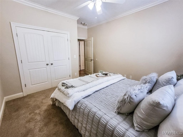 bedroom with ceiling fan, a closet, crown molding, and dark colored carpet