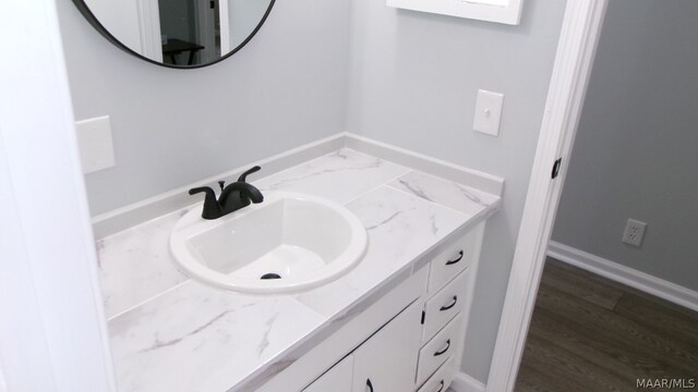 bathroom featuring hardwood / wood-style floors and vanity