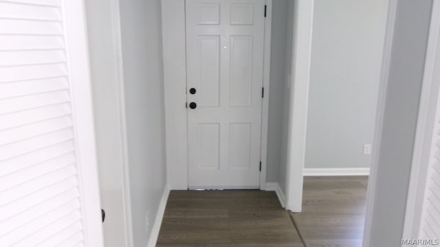 hall with dark hardwood / wood-style floors