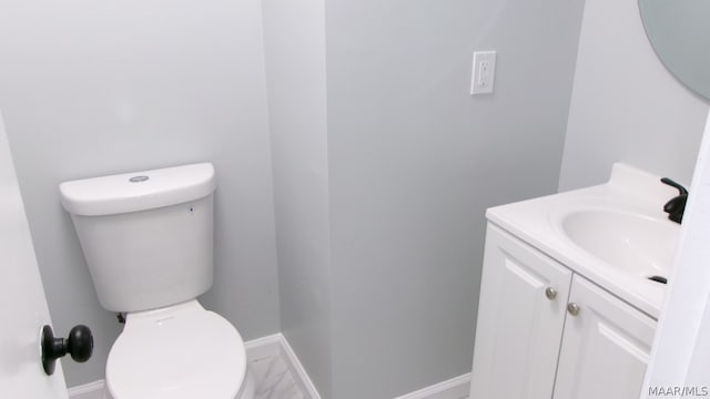 bathroom featuring oversized vanity and toilet