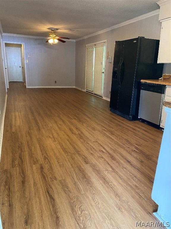 kitchen with ceiling fan, hardwood / wood-style floors, stainless steel dishwasher, a textured ceiling, and white cabinets