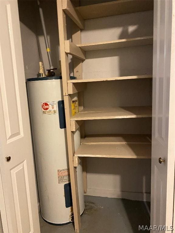 utility room with electric water heater