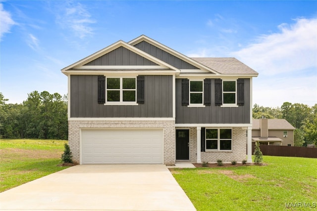 craftsman inspired home featuring a front yard and a garage