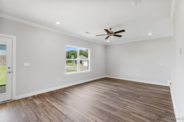 unfurnished room with crown molding, ceiling fan, and dark hardwood / wood-style floors