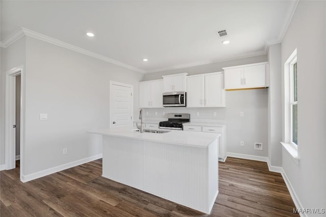 kitchen with white cabinets, sink, an island with sink, and appliances with stainless steel finishes