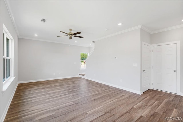 unfurnished room with crown molding, ceiling fan, and light wood-type flooring