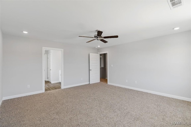 empty room with carpet flooring and ceiling fan