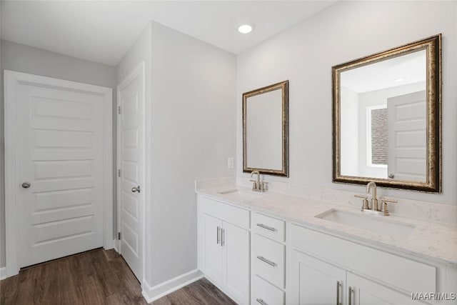 bathroom with hardwood / wood-style flooring and vanity