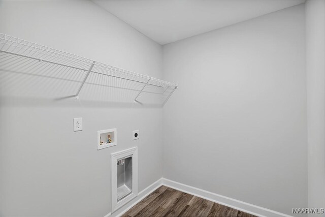 laundry room featuring washer hookup, electric dryer hookup, and dark wood-type flooring