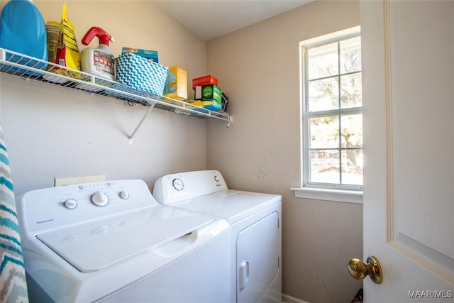 washroom featuring independent washer and dryer and laundry area