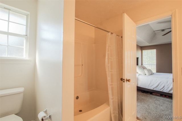 bathroom with shower / tub combo and toilet