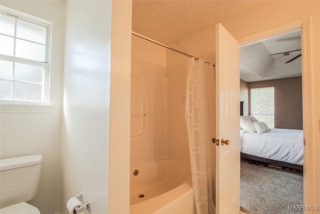 bathroom with shower / bathtub combination with curtain, ensuite bathroom, and toilet