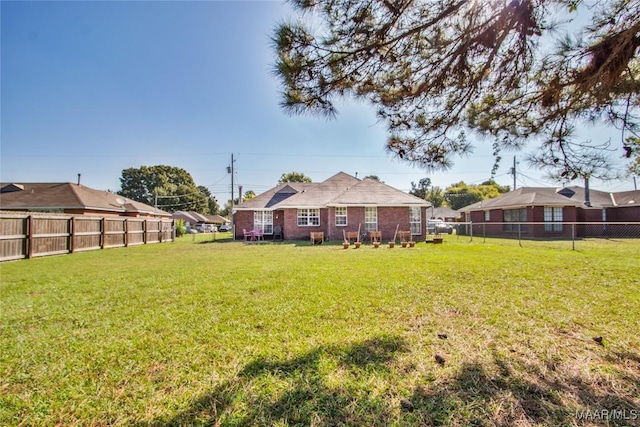 view of yard featuring a fenced backyard