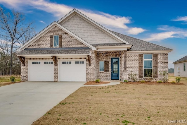 craftsman-style house with a garage and a front lawn