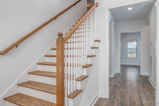 stairway featuring hardwood / wood-style floors