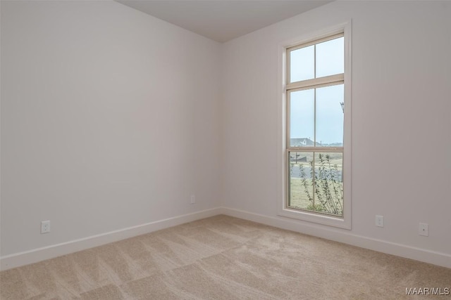 empty room with light colored carpet