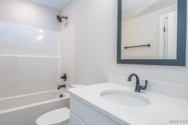 bathroom featuring toilet, bathtub / shower combination, and vanity