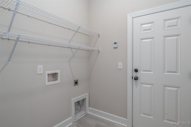 laundry room with washer hookup, laundry area, baseboards, and hookup for an electric dryer