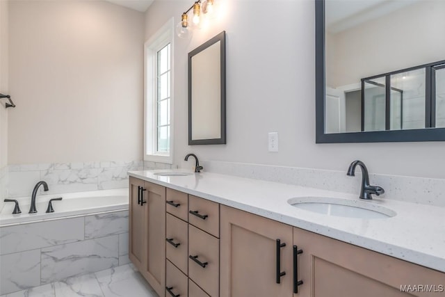 full bath featuring a sink, marble finish floor, a shower stall, and double vanity