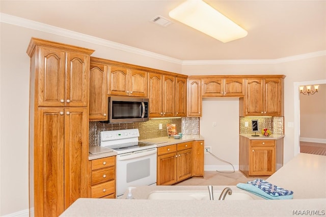 kitchen with white electric range, tasteful backsplash, and ornamental molding