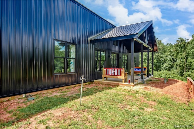 view of home's exterior featuring a yard and a wooden deck