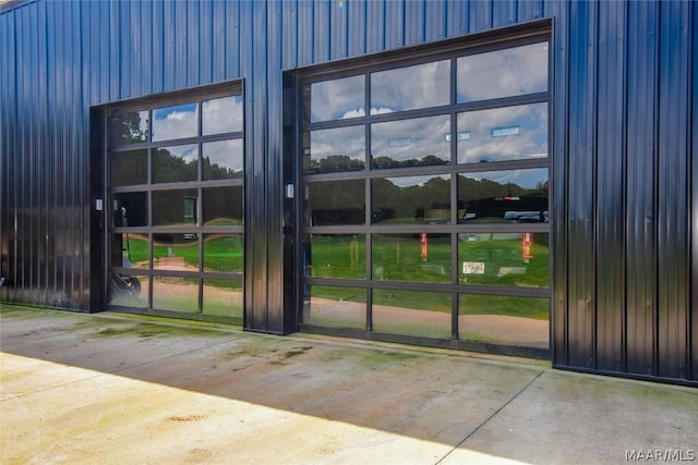 doorway to outside with concrete flooring