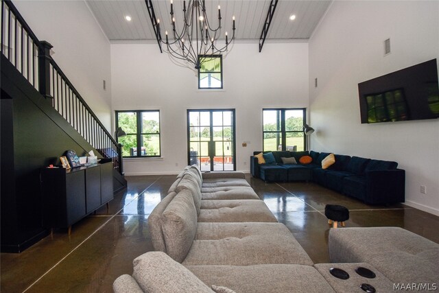 living room with a chandelier and a high ceiling