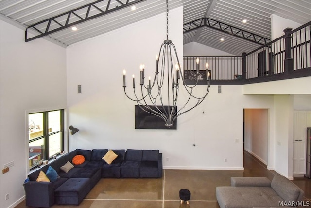 living room featuring high vaulted ceiling and an inviting chandelier