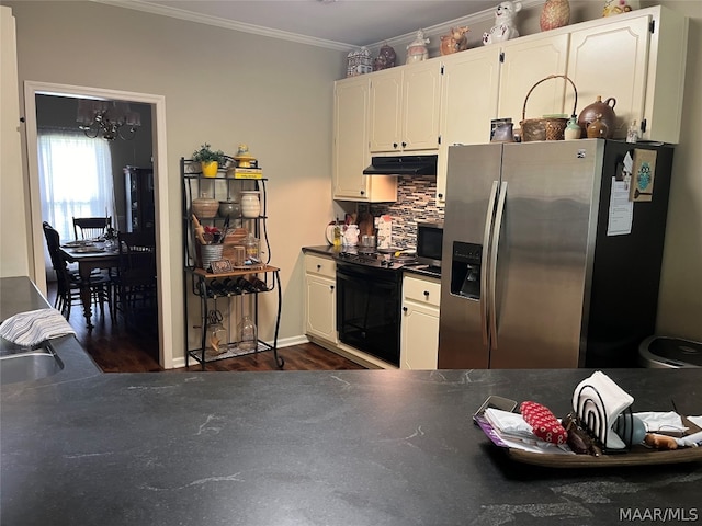 kitchen with dark countertops, black electric range oven, white cabinets, under cabinet range hood, and stainless steel fridge with ice dispenser