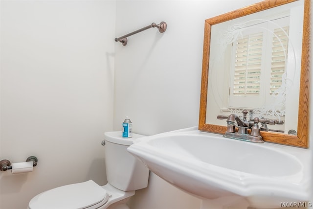 bathroom featuring sink and toilet