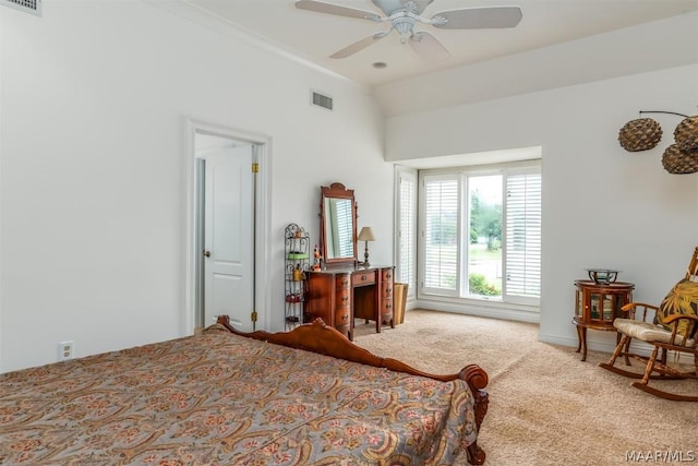 bedroom with a ceiling fan, carpet, visible vents, and lofted ceiling