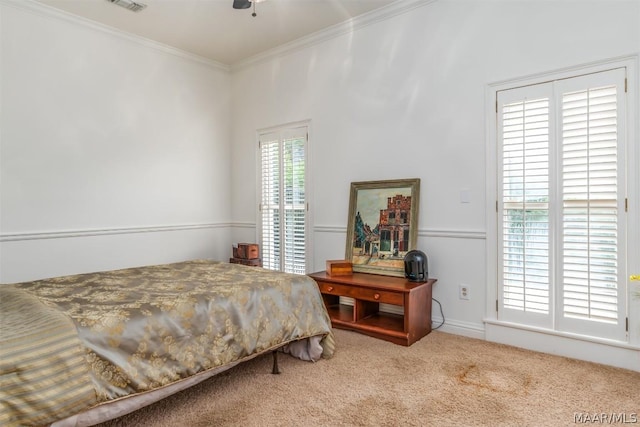 carpeted bedroom with ornamental molding and visible vents