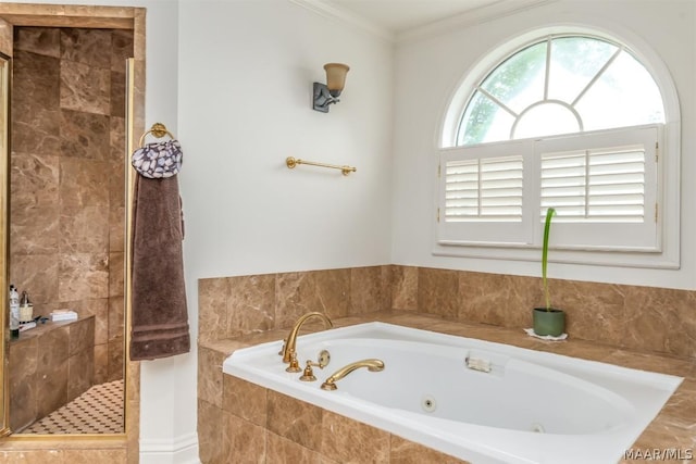 bathroom featuring a stall shower, crown molding, and a tub with jets