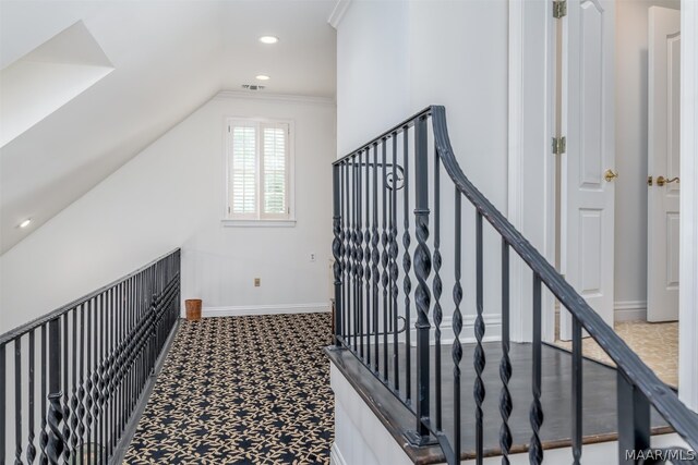 stairs featuring carpet flooring and ornamental molding