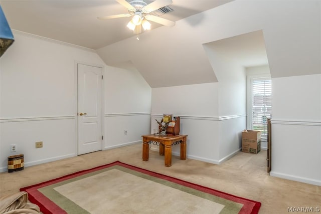 bonus room featuring lofted ceiling, light colored carpet, visible vents, baseboards, and a ceiling fan