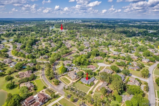 drone / aerial view featuring a water view and a residential view