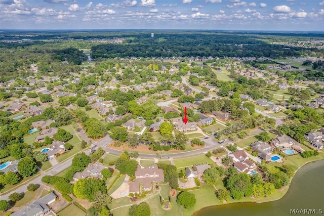 birds eye view of property with a water view and a residential view