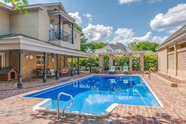 view of pool featuring a patio, a pergola, and ceiling fan