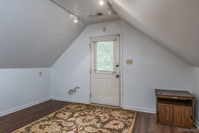 additional living space with lofted ceiling and hardwood / wood-style flooring