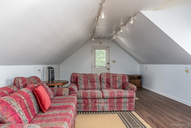 living room with rail lighting, lofted ceiling, and wood-type flooring